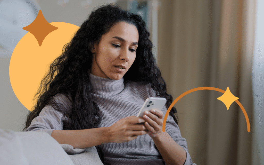 Pessoa pensativa segurando o celular enquanto busca informações sobre saúde mental e controle de bets.